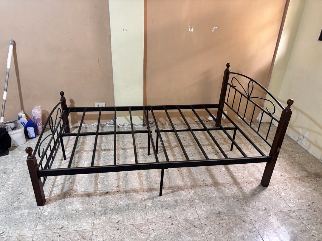 Sturdy Metal & Wood Double Bed Frame (Category: Bed Frames & Mattresses) located in Manila. Submitted by ramzieee (Listing ID 1461111546, Image 3). Description: 🛏️ Sturdy Metal & Wood Double Bed Frame (Black / Dark Wood) Heavy-duty metal bed frame with solid wood corner posts and classic scrollwork detailing on both the headboard and footboard. 📏 Size: Double 🪵 Material: Black steel frame + wood corner posts with ball finials 🛏️ Base Support: