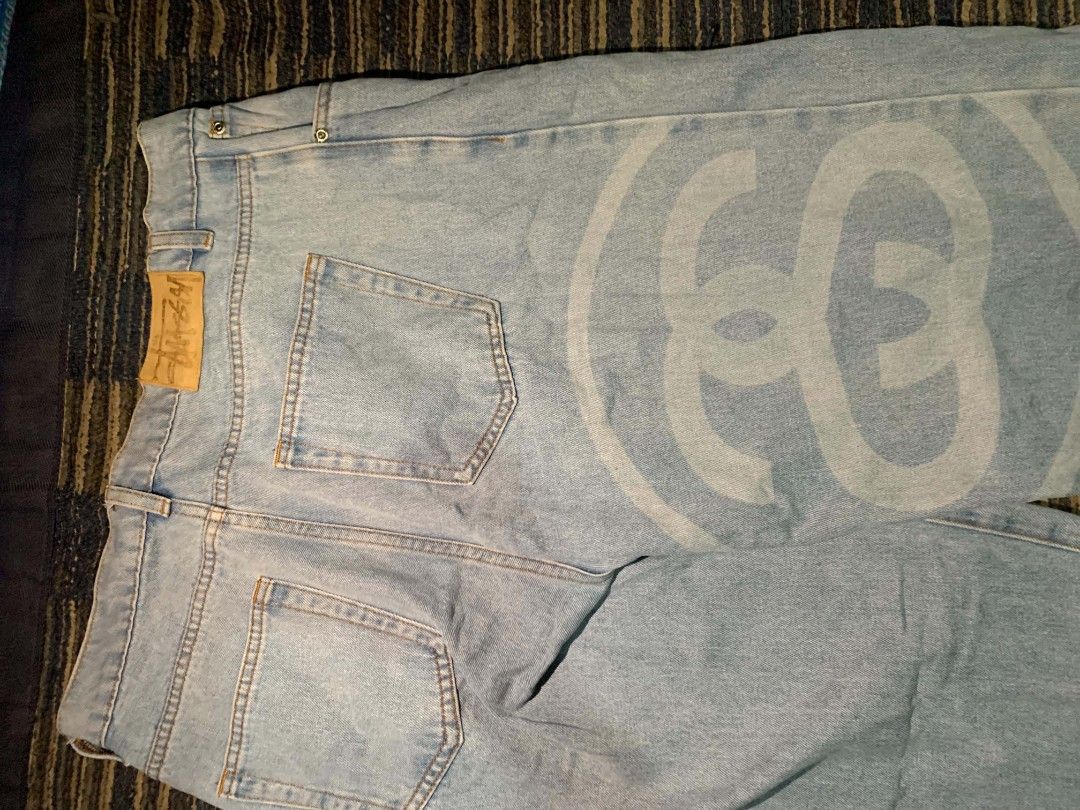 Stussy Light Wash Denim Jeans (Category: Jeans) located in Manila. Submitted by itsyourboymat (Listing ID 1460792461, Image 3). Description: - Light wash denim jeans - Iconic Stussy logo print on the leg - Button fly closure - Classic five-pocket styling - Relaxed fit - Ideal for casual wear.