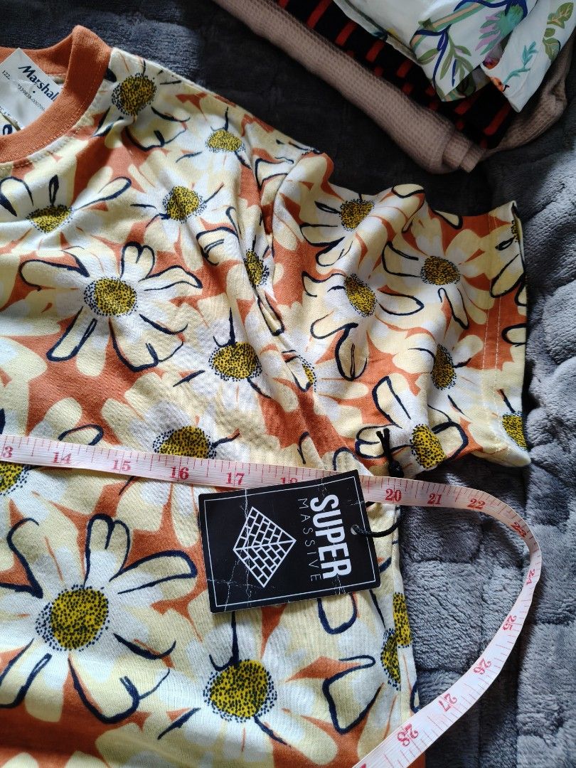 SUPER MASSIVE Daisy Print T-Shirt Orange (Category: Shirts) located in Tarlac. Submitted by momma02 (Listing ID 1460929547, Image 2). Description: - Fun orange t-shirt with an all-over daisy print. - Features white and yellow flowers with black outlines. - Classic crew neck style. - Perfect for a casual, retro vibe. - Approximate measurements: 18 inches pit to pit..