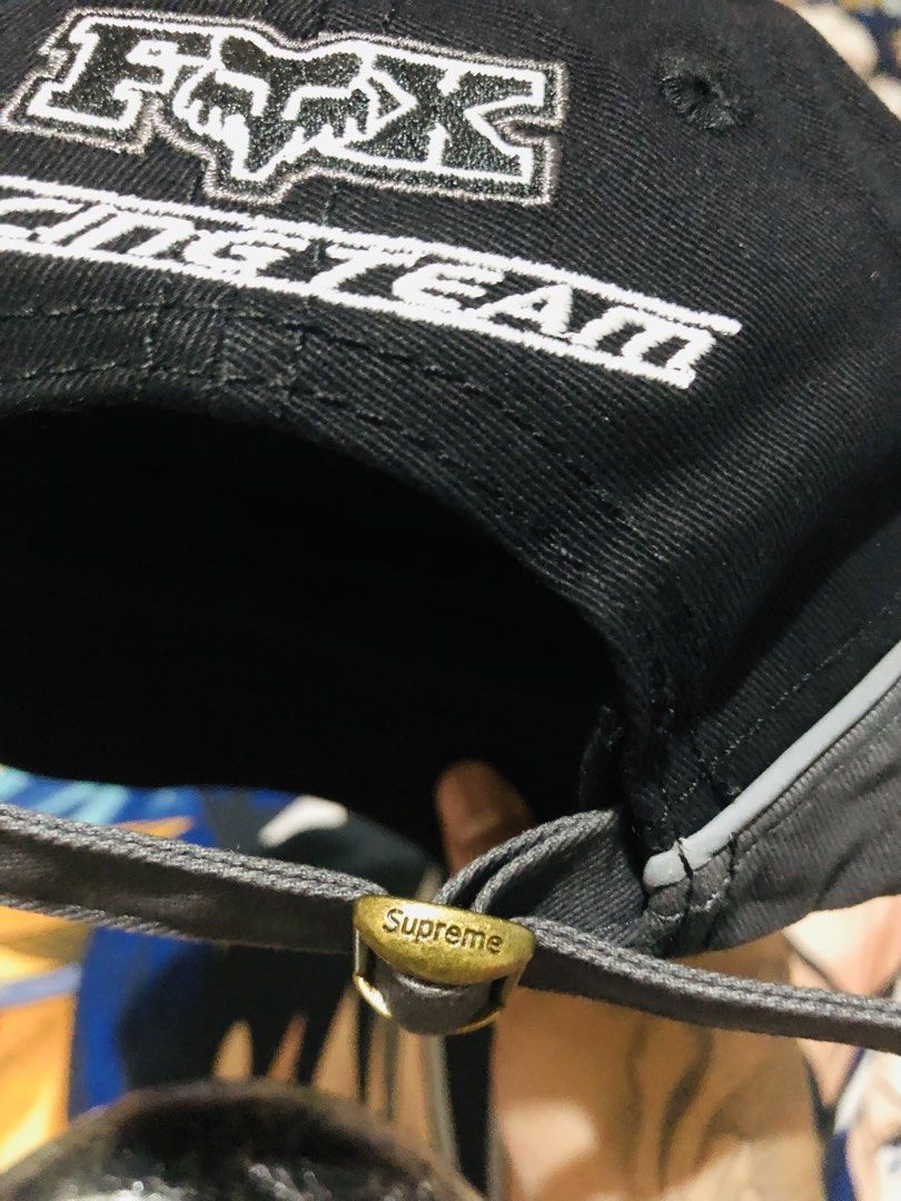 Supreme Fox Racing Cap (Category: Caps & Hats) located in Manila. Submitted by youngmoon_c2e10b (Listing ID 1461108531, Image 3). Description: - Brand new Fox Racing x Supreme cap - Color: Black and Grey - Features 'Racing Team' text on the side - Adjustable strap with metal buckle closure - Comes with original tags attached - Perfect for fans of both brands.