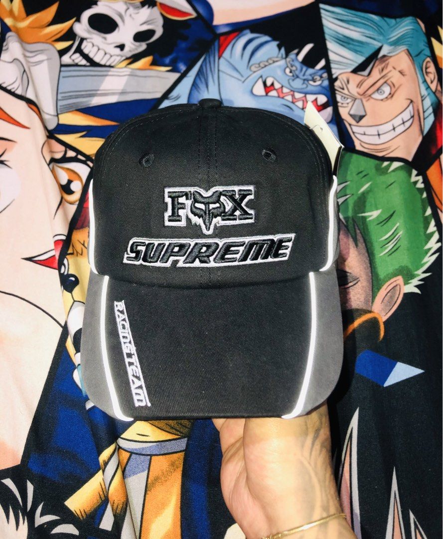 Supreme Fox Racing Cap (Category: Caps & Hats) located in Manila. Submitted by youngmoon_c2e10b (Listing ID 1461108531, Image 1). Description: - Brand new Fox Racing x Supreme cap - Color: Black and Grey - Features 'Racing Team' text on the side - Adjustable strap with metal buckle closure - Comes with original tags attached - Perfect for fans of both brands.