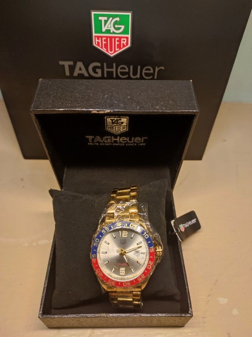 TAG Heuer Watch - Two Tones & Blue Dial Options (Category: Luxury Watches) located in Pasay City. Submitted by mshadesofthrift. (Listing ID 1460940365, Image 1). Description: - Two TAG Heuer watches available . ( Topgrade) - Watch 1: Two-tone gold and silver with a red and blue bezel. - Watch 2: Silver with a blue dial and a black bezel. - Both watches include their original boxes. - Ideal for watch collectors or for everyday wear..