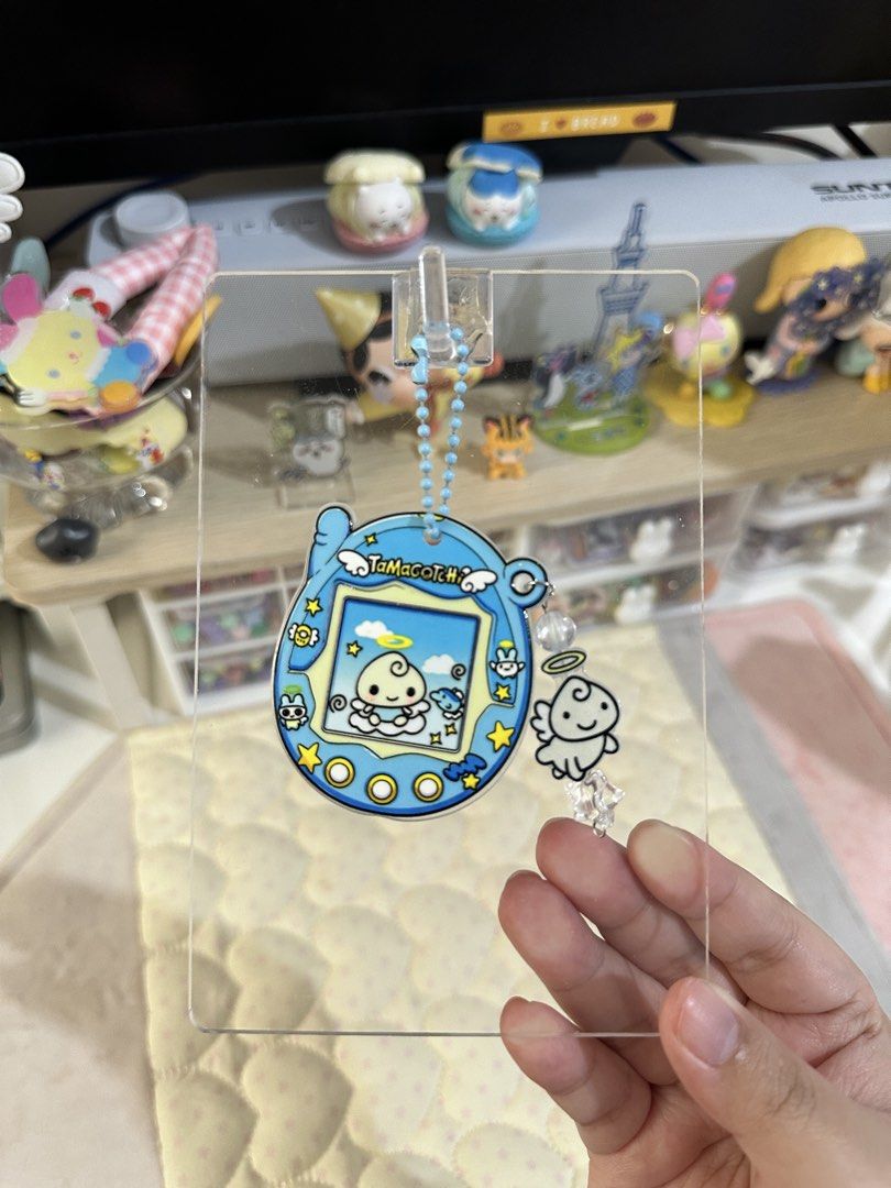 Tamagotchi Angelgotchi Bag Charm (Category: Charms) located in Cainta. Submitted by pomocha (Listing ID 1461034963, Image 1). Description: 🍀Please read before ordering🍀 🍎These charms are handmade by me 🍎When being delivered to you they will be packed with care with proper packaging (plastic and paper backing) for your charm 🫶 🍎There is usually no duplicates of each charm, so don't hesitate because i will most likely never stock this design 