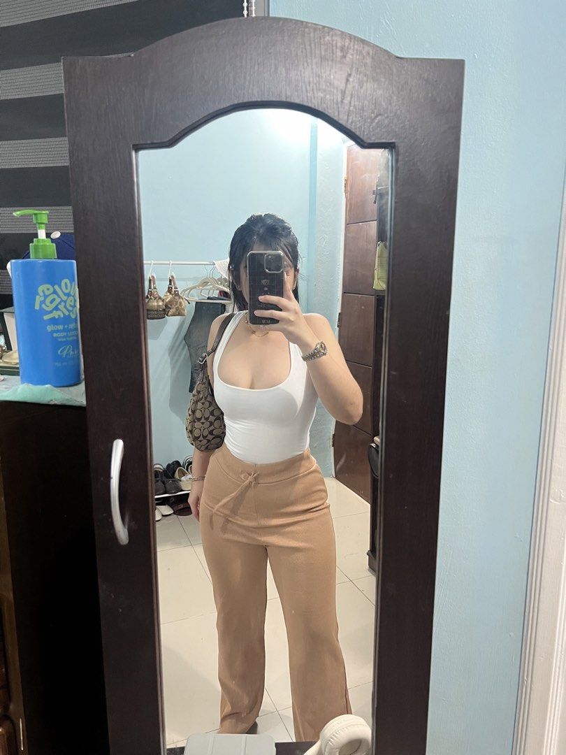 Tan Wide Leg Pants with Drawstring Waist (Category: Other Bottoms) located in Manila. Submitted by camieday04 (Listing ID 1461104814, Image 1). Description: - Comfy tan pants23-27 (L40 - Wide leg style - Ribbed texture - Drawstring waist for adjustable fit - Slit at the hem - Versatile for casual wear, pairs easily with any top.