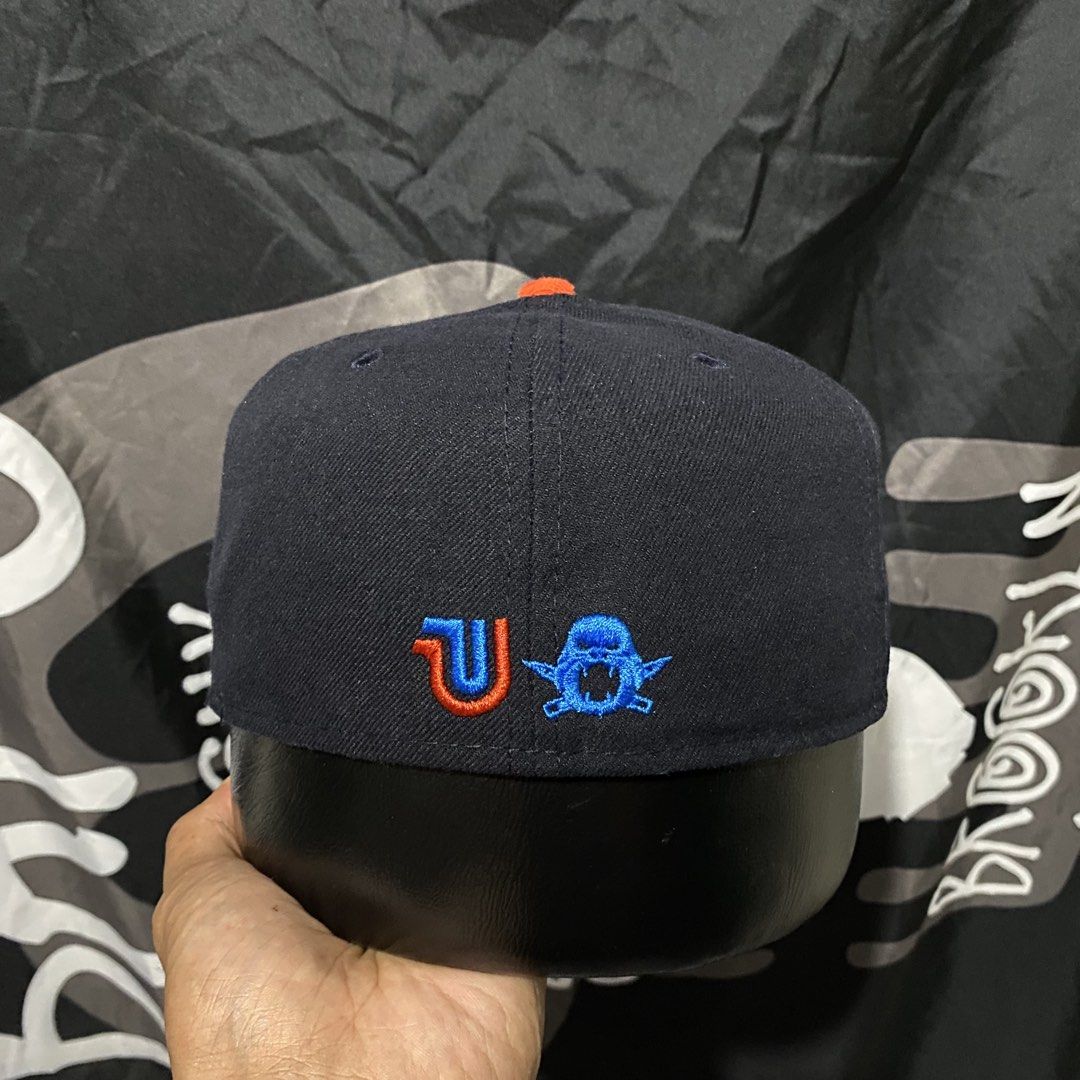 The Clink Room New Era Fitted Cap (Category: Caps & Hats) located in Villasis. Submitted by thriftngrind (Listing ID 1461059836, Image 3). Description: - Brand: New Era X The Clink Room - Model: 59FIFTY Fitted Cap - Color: Navy Blue - Size: 7 1/4 - Side Logo: Small embroidered New Era logo - Top Button: Orange - Limited Edition - Dark Blue colorway.