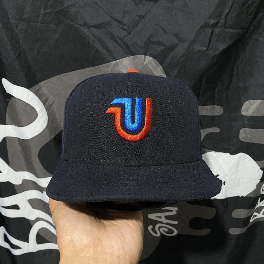 The Clink Room New Era Fitted Cap (Category: Caps & Hats) located in Villasis. Submitted by thriftngrind (Listing ID 1461059836, Image 1). Description: - Brand: New Era X The Clink Room - Model: 59FIFTY Fitted Cap - Color: Navy Blue - Size: 7 1/4 - Side Logo: Small embroidered New Era logo - Top Button: Orange - Limited Edition - Dark Blue colorway.
