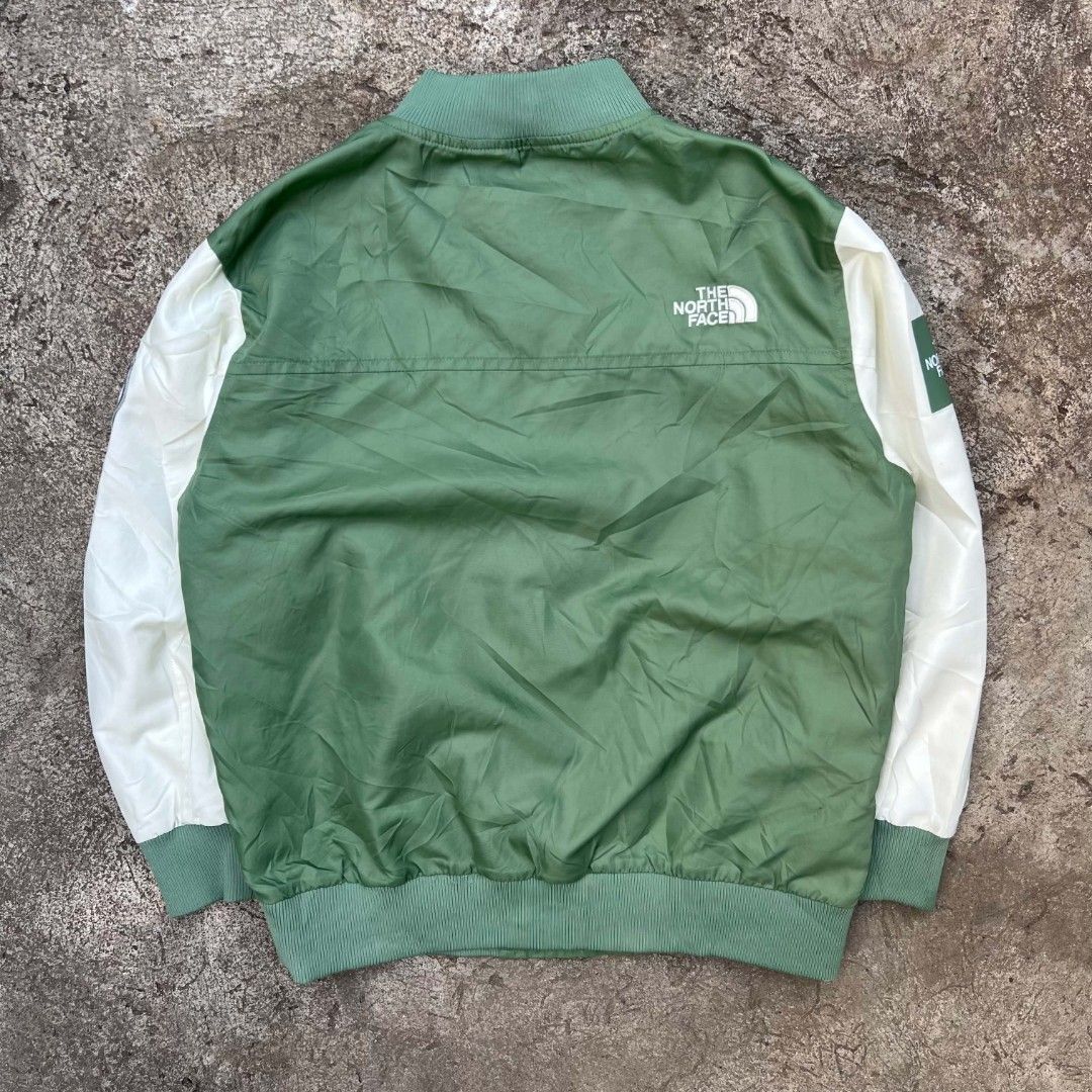 The North Face Bomber Jacket Green White Size 150 (Category: Babies & Kids Fashion) located in Cebu City. Submitted by royalwolf-2a85 (Listing ID 1461026972, Image 3). Description: - The North Face bomber jacket - Color: Green body with white sleeves - Features The North Face logo on chest and sleeve - Size: 150 (Great for kids) - width 21 - length 22.5 - excellent condition - minimal issue last photo - "Never Stop Exploring" tag inside - Ideal f