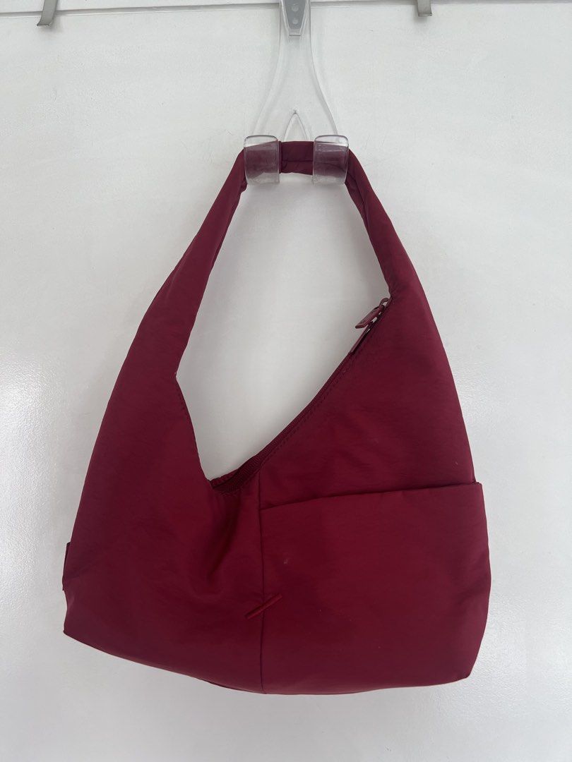 The Paper Bunny Mini Arc (Burgundy) (Category: Shoulder Bags) located in Makati City. Submitted by hereasysupply (Listing ID 1460964374, Image 1). Description: Blending style and functionality, the Mini Arc is a slouchy hobo-style bag that is compact enough to carry in your hand, yet spacious enough to hold all your essentials. PRODUCT DETAILS -Made with water-resistant nylon -Double zipper closure for convenient access no matter which side of yo