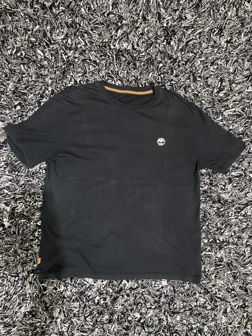 Timberland Black T-Shirt with Logo (Category: Tshirts & Polo Shirts ) located in Baguio. Submitted by arenzu (Listing ID 1461074099, Image 1). Description: - Classic black Timberland t-shirt - Iconic embroidered tree logo on chest - Subtle orange and grey detail on inner neckline - Small orange Timberland tag on the side - Ideal for casual everyday wear.