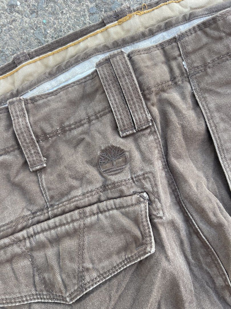 Timberland Cargo Shorts Brown Men's Size (Category: Shorts) located in Oroquieta. Submitted by sagarinocr57887 (Listing ID 1461049756, Image 3). Description: - Brown Timberland cargo shorts - Multiple pockets for ample storage - Secure button and zip closure - Made with durable material for long-lasting wear - Features classic Timberland tree logo embossed on front pocket and button - Perfect for casual outings or outdoor adventures - Ready for i
