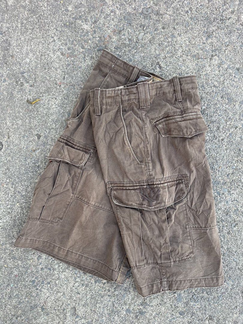 Timberland Cargo Shorts Brown Men's Size (Category: Shorts) located in Oroquieta. Submitted by sagarinocr57887 (Listing ID 1461049756, Image 1). Description: - Brown Timberland cargo shorts - Multiple pockets for ample storage - Secure button and zip closure - Made with durable material for long-lasting wear - Features classic Timberland tree logo embossed on front pocket and button - Perfect for casual outings or outdoor adventures - Ready for i