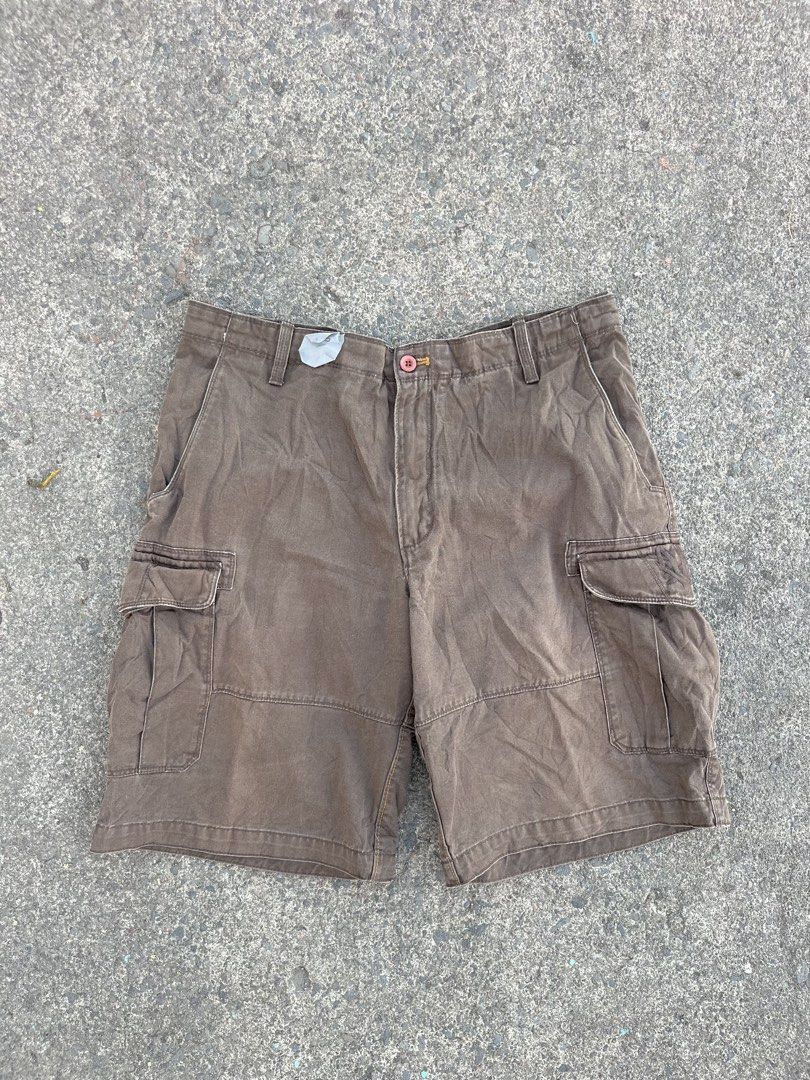 Timberland Cargo Shorts Brown Men's Size (Category: Shorts) located in Oroquieta. Submitted by sagarinocr57887 (Listing ID 1461049756, Image 2). Description: - Brown Timberland cargo shorts - Multiple pockets for ample storage - Secure button and zip closure - Made with durable material for long-lasting wear - Features classic Timberland tree logo embossed on front pocket and button - Perfect for casual outings or outdoor adventures - Ready for i