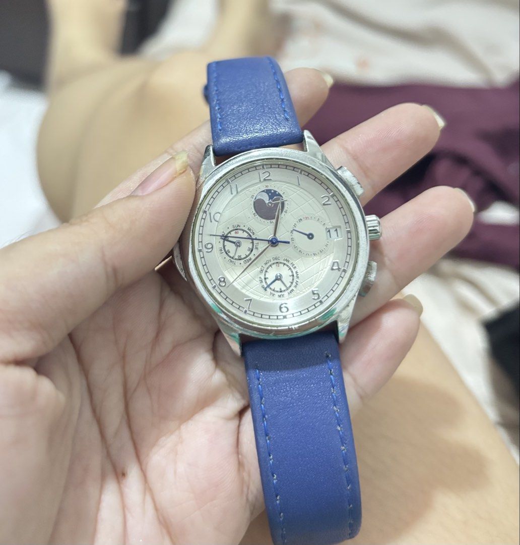 Tomato Time Japan Movement Watch Blue Leather Strap (Category: Women's Watches) located in Lapu Lapu. Submitted by affordmo (Listing ID 1461095693, Image 1). Description: - Tomato Time watch with reliable Japan movement. - Stylish blue leather strap. - Watch face includes day, date, and moon phase indicators. - Minor cosmetic wear on the casing. - Working.
