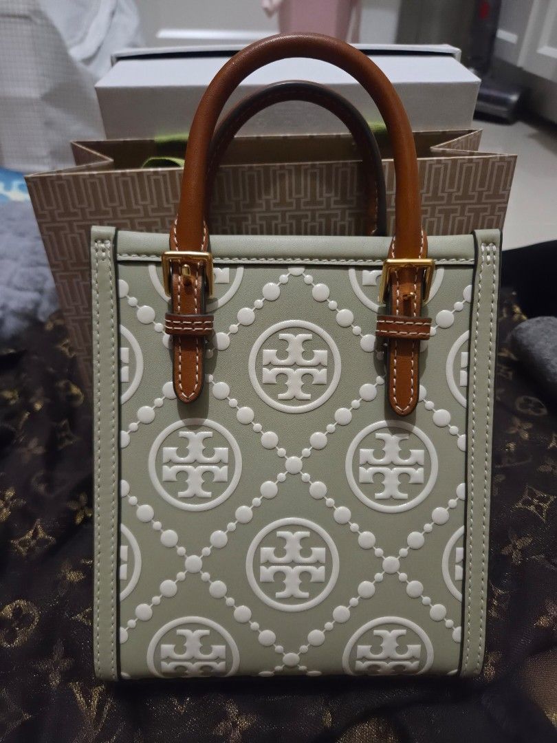 Tory Burch Ella Mini Tote Bag Pale Green (Category: Luxury Bags & Wallets) located in Pasig City. Submitted by sashasarisarishoppe (Listing ID 1460980696, Image 2). Description: - Pale green Tory Burch Ella Mini Tote - Signature logo pattern embossed all over - Top handles - Detachable crossbody strap -Authentic bought in Rustans Tory Burch store - Interior small pocket - Gold hardware details - Ideal for everyday use or a night out.
