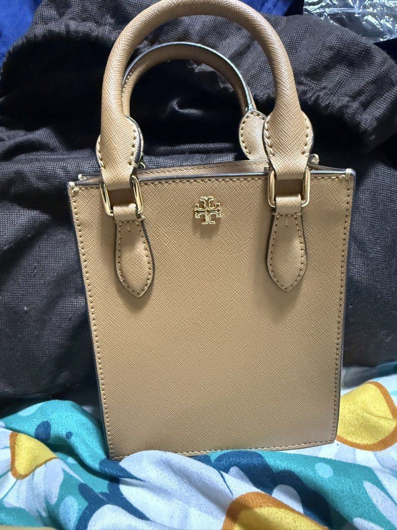 Tory burch mini tote bag (Category: Cross-body Bags) located in Quezon City. Submitted by kashbags (Listing ID 1460969335, Image 1). Description: Original Tory Burch Mini Tote Bag 🤎✨ Condition: Like New / Excellent Condition Color: Beige / Taupe Style: Elegant & classy mini tote Includes: Detachable sling strap — can be worn as a handbag or crossbody 👜 ✔️ Structured and stylish ✔️ Gold-tone hardware ✔️ Perfect for everyday use or special occasi