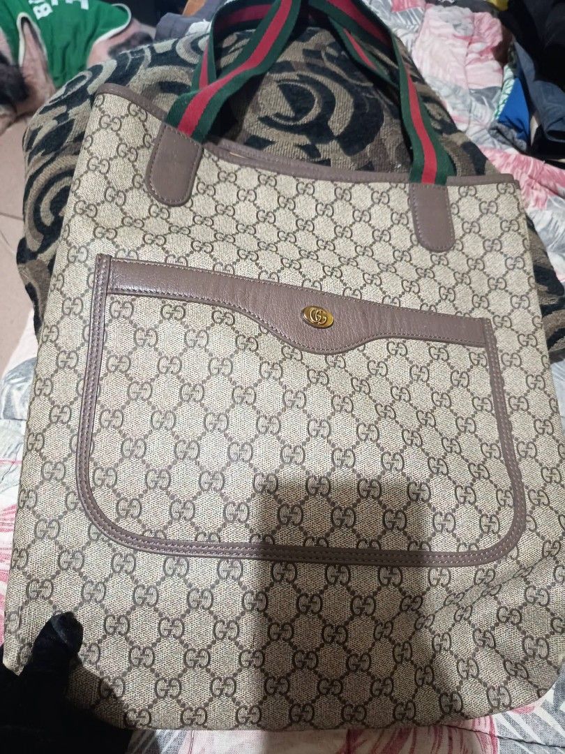 Tote bag (Category: Tote Bags) located in Agoo. Submitted by yurimarie29 (Listing ID 1461054400, Image 1). Description: Guaranteed OG vintage G*"G Supreme canvas tote bag featuring green and red web stripe handles and an exterior front pocket. RANK A.
