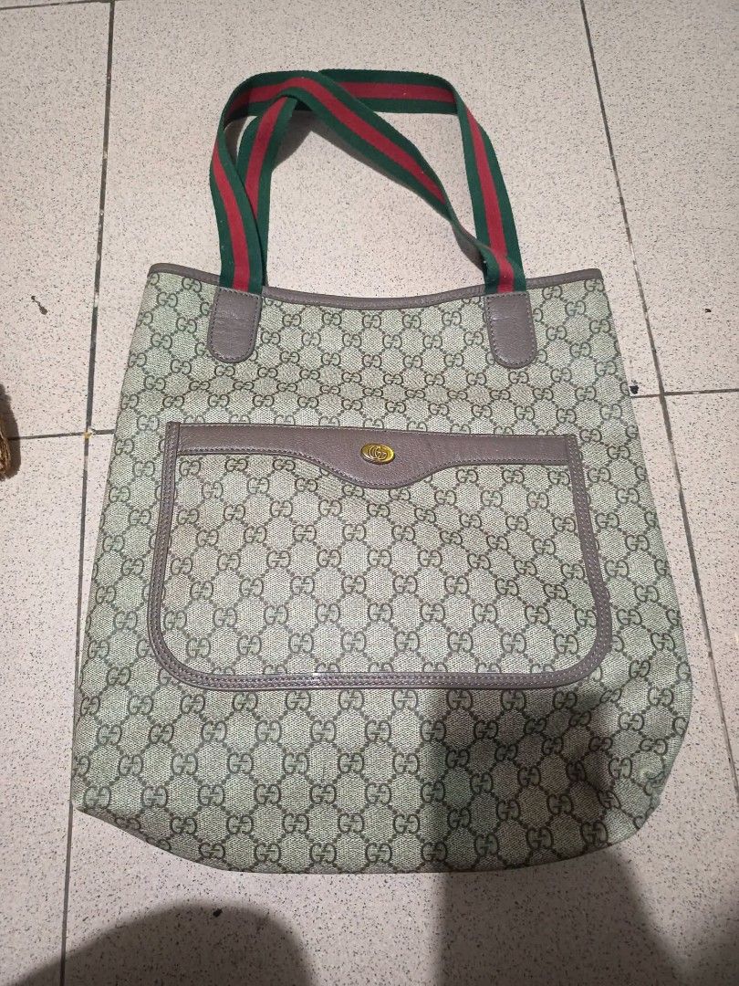 Tote bag (Category: Tote Bags) located in Agoo. Submitted by yurimarie29 (Listing ID 1461054400, Image 2). Description: Guaranteed OG vintage G*"G Supreme canvas tote bag featuring green and red web stripe handles and an exterior front pocket. RANK A.