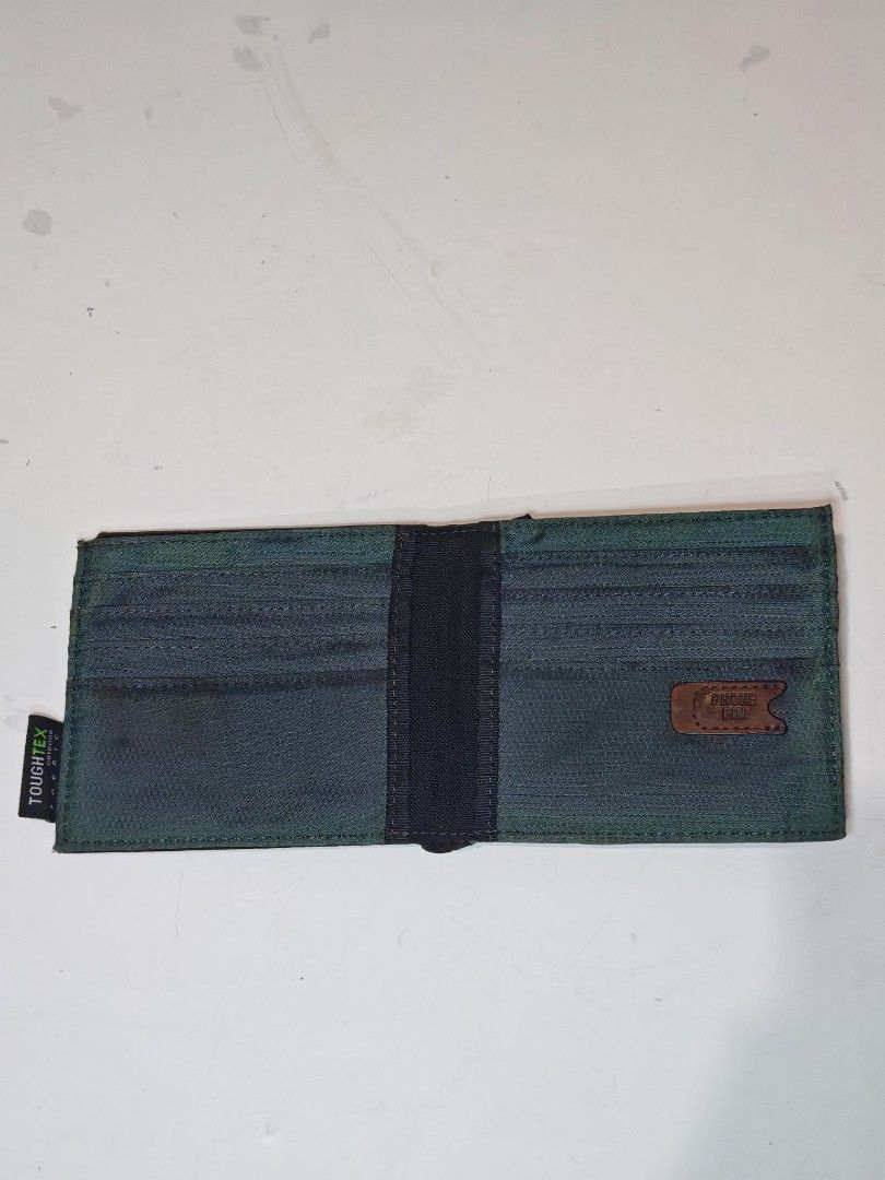 Tough Jeansmith Premium Leather Wallet (Category: Wallets & Card Holders) located in Cavite. Submitted by zekesfinds (Listing ID 1461091916, Image 3). Description: Tough Jeansmith Premium Leather Wallet YKK zipper Multiple card slots coin compartment Slim style with phone pin slot Toughtex Fabric.