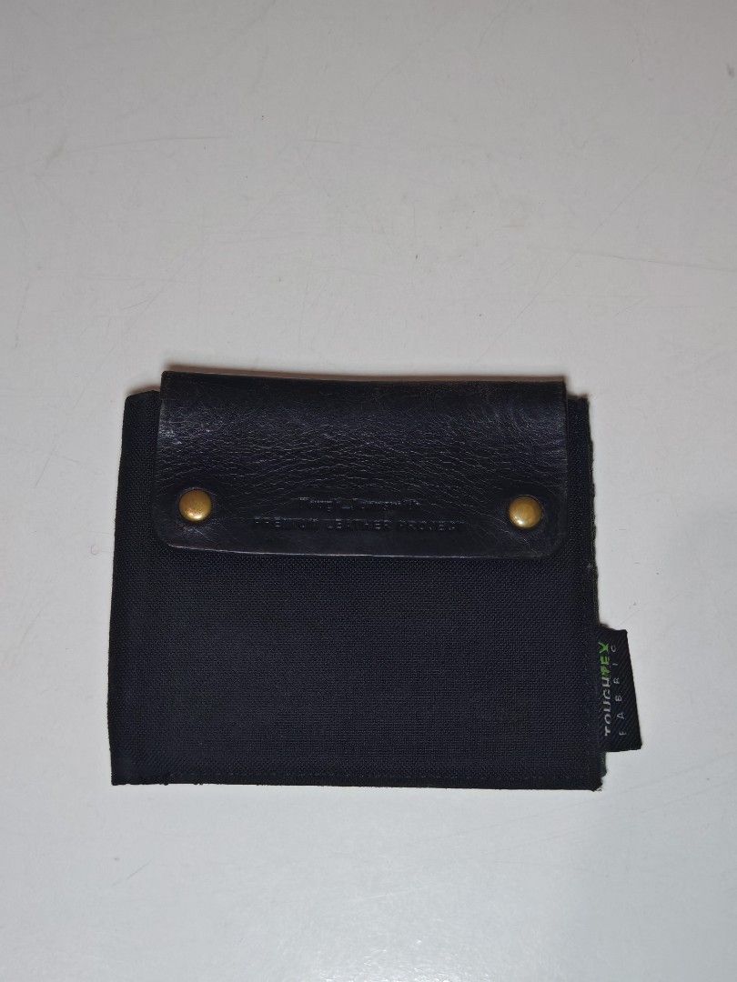 Tough Jeansmith Premium Leather Wallet (Category: Wallets & Card Holders) located in Cavite. Submitted by zekesfinds (Listing ID 1461091916, Image 1). Description: Tough Jeansmith Premium Leather Wallet YKK zipper Multiple card slots coin compartment Slim style with phone pin slot Toughtex Fabric.
