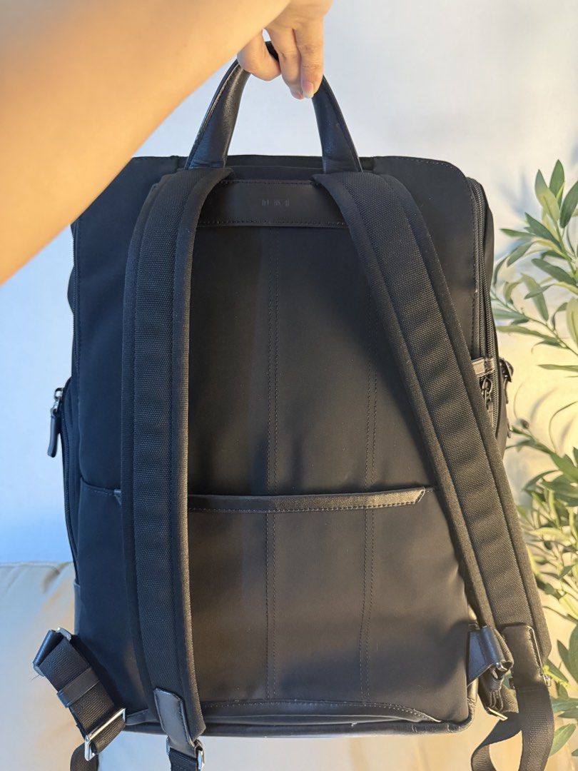 TUMI HARRISON Osborn Roll Top Backpack (Category: Backpacks) located in Pasig City. Submitted by elly0311 (Listing ID 1461088747, Image 3). Description: - Main compartment with zip closure - Front flap with buckle closure - Multiple exterior zip pockets for easy access - Padded shoulder straps for comfort Spacious main compartment - Top carry handle + adjustable backpack straps - TUMI hardware and luggage tag - Ideal for: work, travel, or everyda