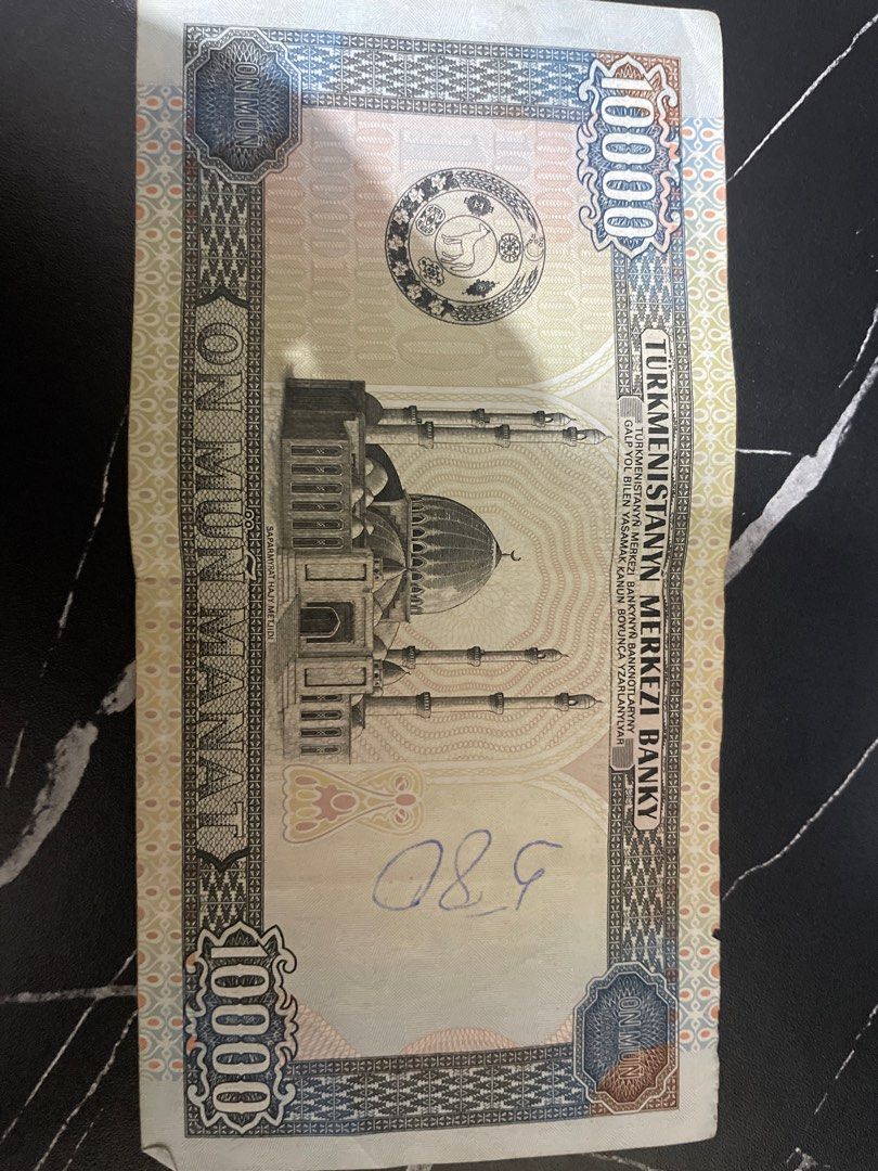 Turkmenistan 1000 Manat Banknote (Category: Currency) located in Manila. Submitted by mzzzxxxx.41 (Listing ID 1460940819, Image 2). Description: - Turkmenistan 1000 Manat banknote - Features the National Bank building on one side - Features a mosque on the other side - Visible serial number: AA6113105 - Ideal for banknote collectors - Makes a unique souvenir.