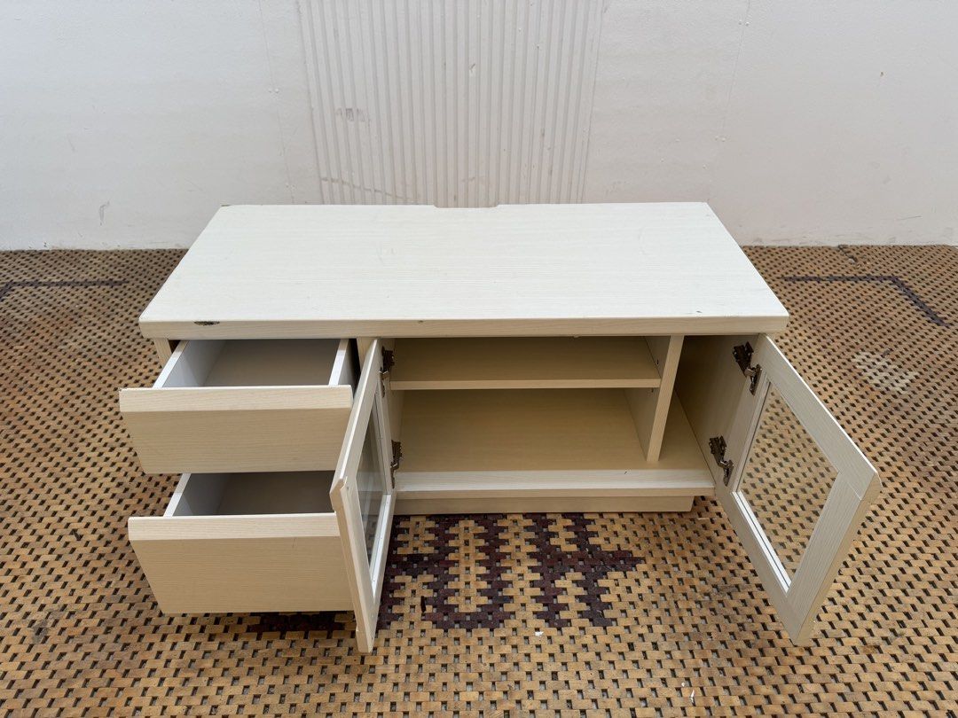 Tv rack (Category: TV Consoles) located in Quezon City. Submitted by matetdevis13 (Listing ID 1460945721, Image 3). Description: Compact White TV Rack with Drawers Price: 3,500 L35.5 x W16 x H17.5 In good condition Code MJS8-RP80.