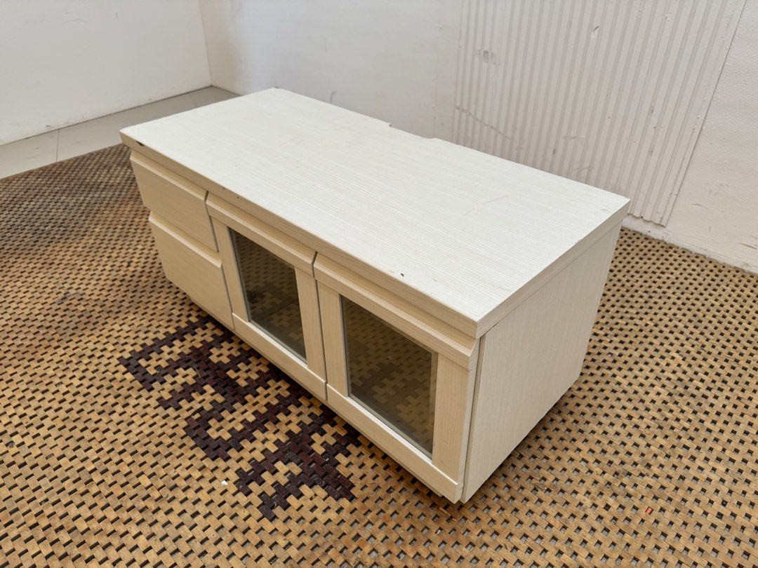 Tv rack (Category: TV Consoles) located in Quezon City. Submitted by matetdevis13 (Listing ID 1460945721, Image 2). Description: Compact White TV Rack with Drawers Price: 3,500 L35.5 x W16 x H17.5 In good condition Code MJS8-RP80.