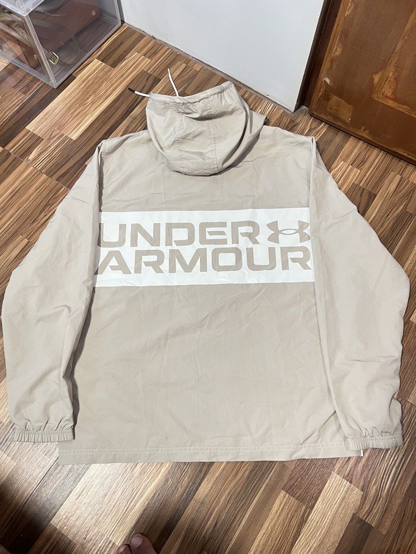 Under Armour Hooded Windbreaker Jacket Beige White (Category: Coats, Jackets and Outerwear) located in Manila. Submitted by flynnt2 (Listing ID 1461094026, Image 3). Description: UNDERAMOUR NO ISSUE LIKE NEW - Lightweight Under Armour jacket - Stylish colorblocked design (beige and white) - Features Under Armour logo on chest - Large logo graphic on the back - Hooded with adjustable drawstring - Elastic cuffs and hem for a snug fit - Ideal for ca