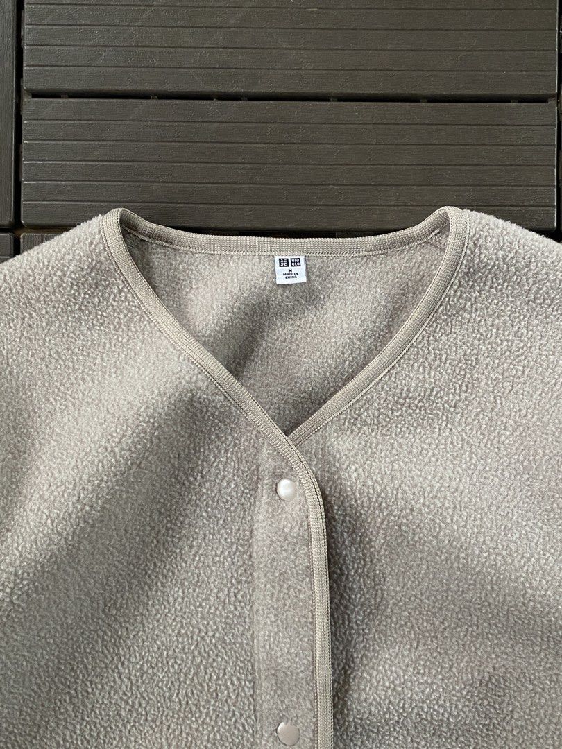 Uniqlo Fleece Button Up Jacket Size M (Category: Coats, Jackets and Outerwear) located in Puerto Princesa. Submitted by streetnfinds (Listing ID 1461073575, Image 2). Description: Length: 31" Width: 20" Sleeve Length: 21" Medium-Large - Uniqlo Fleece Jacket - Color: Light Beige/Grey - Style: Button-up V-neck - Material: Soft and cozy fleece - Features: Great for layering - Size: Medium (M) - Origin: Made in China.