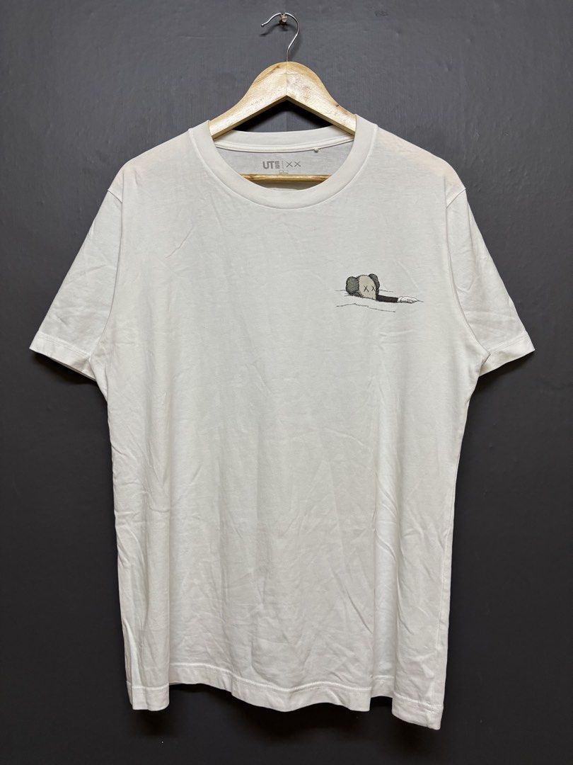 Uniqlo KAWS (Category: Tshirts & Polo Shirts ) located in Cavite. Submitted by staythrifted.23 (Listing ID 1460971427, Image 1). Description: Size : Large to XL Dimes : Lenght 28 Width 22.5 Condition : Like new Color rate : 10/10 Washed and ready to wear Issue : None Loc. Cavite We ship nationwide Payment first .