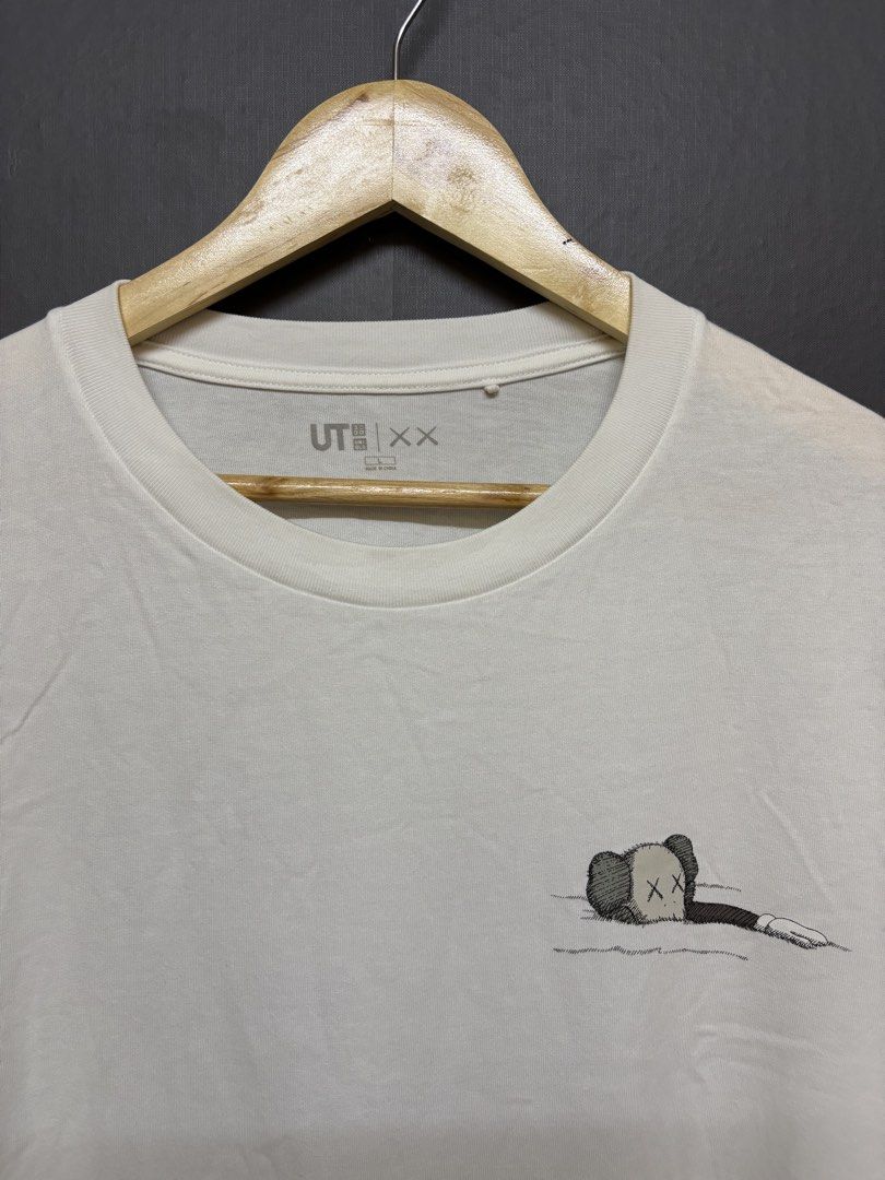Uniqlo KAWS (Category: Tshirts & Polo Shirts ) located in Cavite. Submitted by staythrifted.23 (Listing ID 1460971427, Image 2). Description: Size : Large to XL Dimes : Lenght 28 Width 22.5 Condition : Like new Color rate : 10/10 Washed and ready to wear Issue : None Loc. Cavite We ship nationwide Payment first .