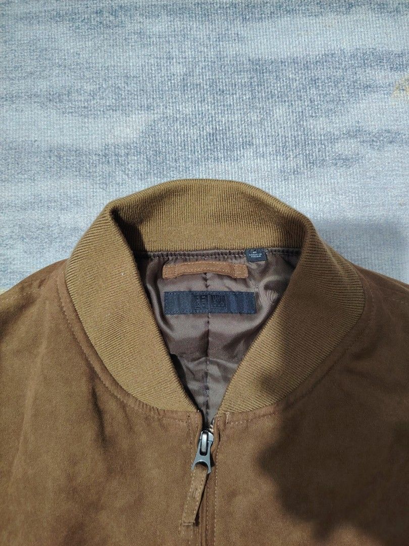 UNIQLO SUEDE BOMBER JACKET (Category: Coats, Jackets and Outerwear) located in Dagupan City. Submitted by gandita.28 (Listing ID 1461046996, Image 3). Description: UNIQLO FAUX SUEDE BOMBER JACKET YKK ZIP MEDIUM ON TAG DARK BROWN ACTUAL COLOR ( COLOR MAY VARY DUE TO LIGHTING) EXCELLENT CONDITION.