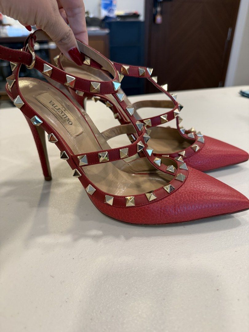 VALENTINO GARAVANI ROCKSTUD PUMPS (Category: Sneakers & Footwear) located in Pasig City. Submitted by marketplacesellinginc (Listing ID 1460998596, Image 2). Description: ❤️ FOR SALE: VALENTINO GARAVANI ROCKSTUD PUMPS A gorgeous and iconic pair of Valentino Garavani Rockstud pumps in a striking red color. Featuring the signature pyramid studs and elegant pointed-toe silhouette — a true statement piece! 👠 Brand: Valentino Garavani 📏 Size: 37½ 🇮