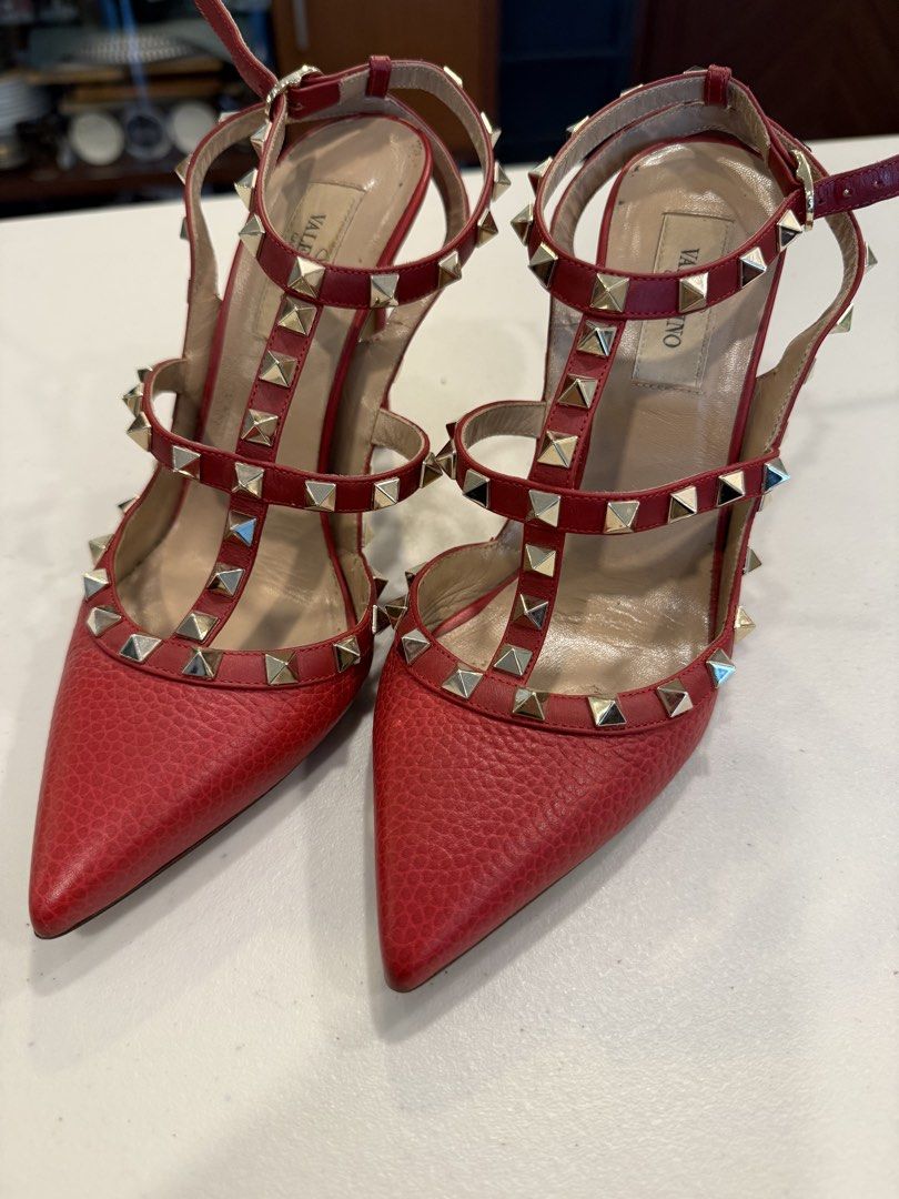 VALENTINO GARAVANI ROCKSTUD PUMPS (Category: Sneakers & Footwear) located in Pasig City. Submitted by marketplacesellinginc (Listing ID 1460998596, Image 1). Description: ❤️ FOR SALE: VALENTINO GARAVANI ROCKSTUD PUMPS A gorgeous and iconic pair of Valentino Garavani Rockstud pumps in a striking red color. Featuring the signature pyramid studs and elegant pointed-toe silhouette — a true statement piece! 👠 Brand: Valentino Garavani 📏 Size: 37½ 🇮