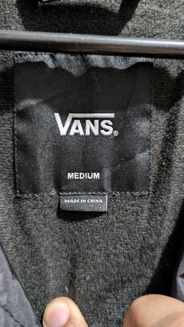 Vans "Off The Wall" Custom Classics Jacket Medium Black (Category: Coats, Jackets and Outerwear) located in Manila. Submitted by bravehawk_bba564 (Listing ID 1460929247, Image 3). Description: - Vans Torrey Coach Jacket Black -Size: Medium, Dimes: 22W 28L (Both) - Made in China - Features: Button-up front, collar, drawstring hem, Vans logo on chest (both), Vans Logo on back (navy blue), soft inner lining - Minimal Issue: may scorch mark sa back c