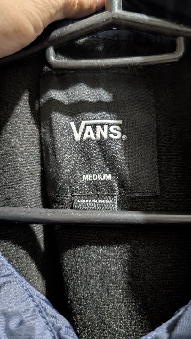 Vans "The Original Off The Wall Since 1966" Coach Jacket (Category: Coats, Jackets and Outerwear) located in Manila. Submitted by bravehawk_bba564 (Listing ID 1460929248, Image 2). Description: - Vans Torrey Coach Jacket Navy Blue - Size: Medium, Dimes: 22W 28L - Made in China - Features: Button-up front, collar, drawstring hem, Vans logo on chest (both), Vans Logo on back (navy blue), soft inner lining Location: Valenzuela City .