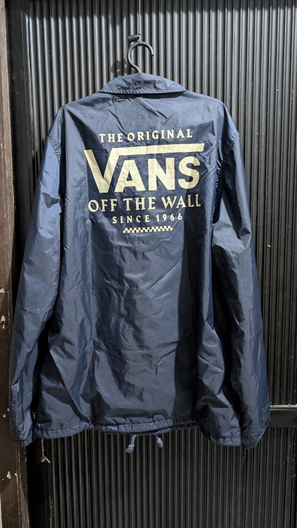 Vans "The Original Off The Wall Since 1966" Coach Jacket (Category: Coats, Jackets and Outerwear) located in Manila. Submitted by bravehawk_bba564 (Listing ID 1460929248, Image 3). Description: - Vans Torrey Coach Jacket Navy Blue - Size: Medium, Dimes: 22W 28L - Made in China - Features: Button-up front, collar, drawstring hem, Vans logo on chest (both), Vans Logo on back (navy blue), soft inner lining Location: Valenzuela City .