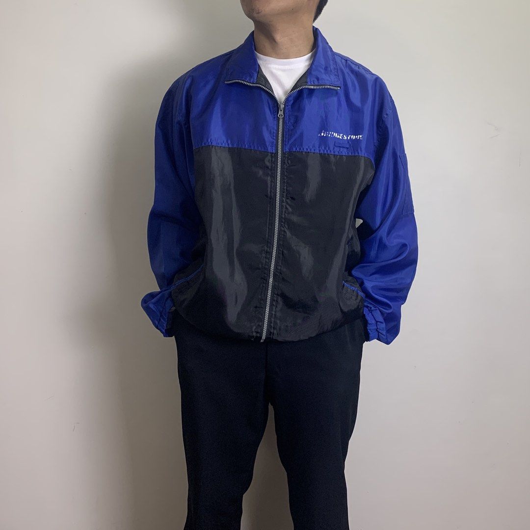 Vintage Blizzak Revolution Racing Windbreaker (Category: Coats, Jackets and Outerwear) located in Baguio. Submitted by been.aged_ph (Listing ID 1460975613, Image 3). Description: 𝚂𝚒𝚣𝚎: fits up to 2XL 𝙳𝚒𝚖𝚎𝚗𝚜𝚒𝚘𝚗𝚜: 26 x 29 𝙲𝚘𝚗𝚍𝚒𝚝𝚒𝚘𝚗: Good 𝙸𝚜𝚜𝚞𝚎: prints (see photos for reference) Model Height: 5' 7" .