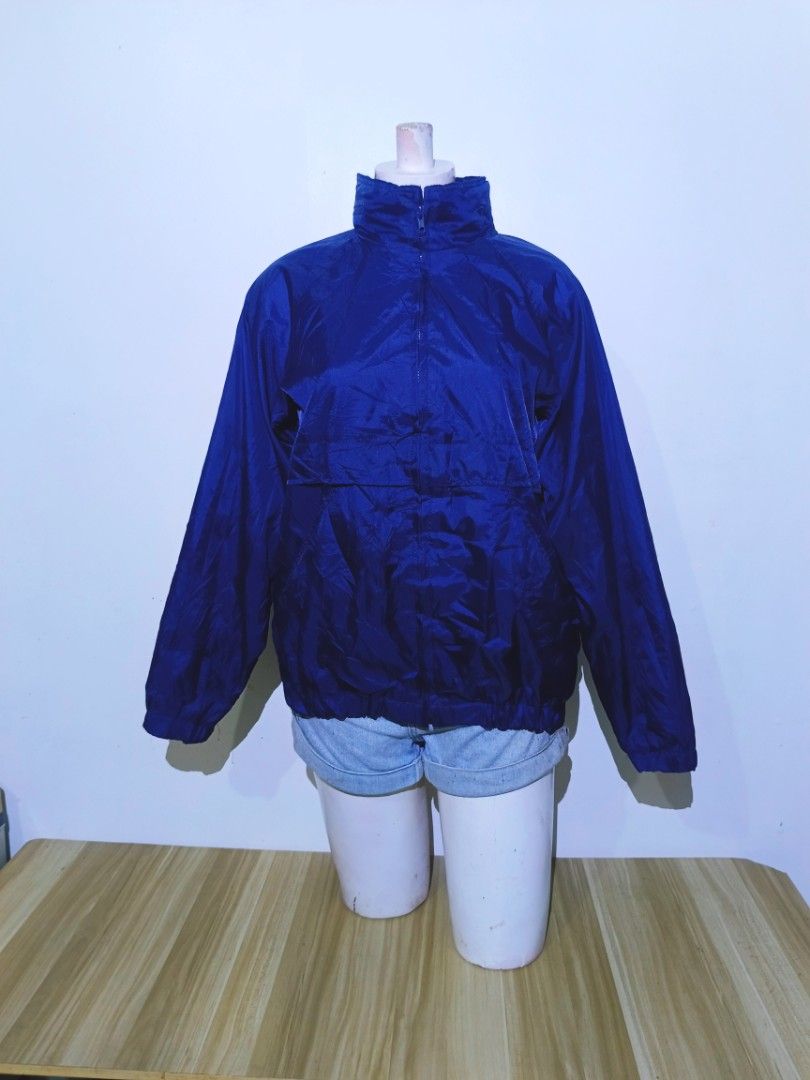 VINTAGE Currentseen Blue Windbreaker Jacket M/M (Category: Coats, Jackets and Outerwear) located in Bayambang. Submitted by meowww1819 (Listing ID 1461072612, Image 1). Description: - Brand: Currentseen - Type: Blue Windbreaker Jacket - Size: M - Origin: Made in Russia - Features: Quarter zip, stand-up collar, large front pocket - Material: Lightweight, ideal for layering - Best for: Casual wear, outdoor activities.