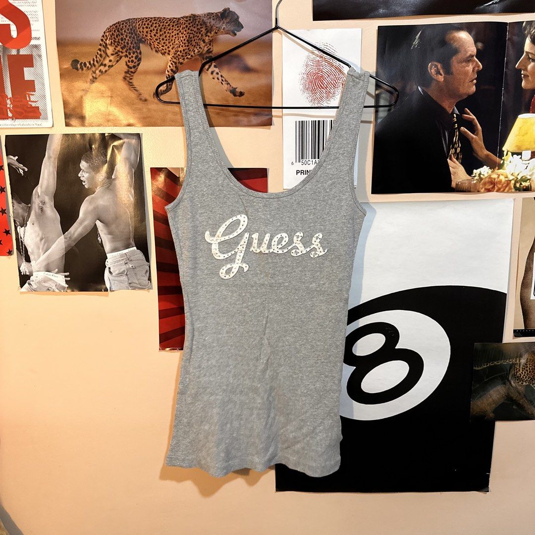 Vintage Guess Grey Ribbed Rhinestone Script Logo Tank Top (Category: Sleeveless) located in Manila. Submitted by andreidenise (Listing ID 1461023572, Image 1). Description: best fit: m can fit s but it wont be body hugging can fit l also - incomplete rhinestones (not noticeable pag malayo hahahaha) .