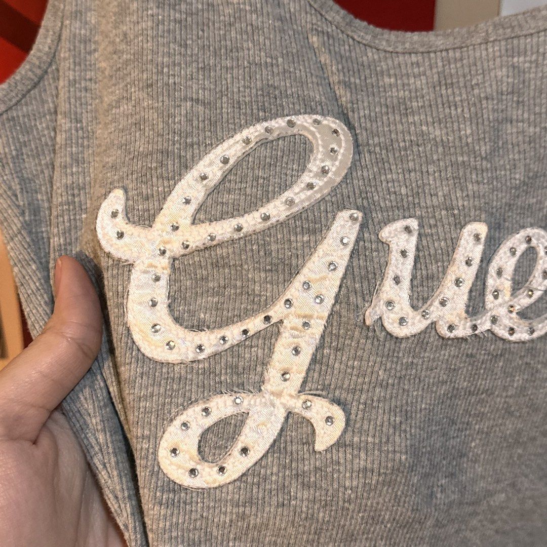Vintage Guess Grey Ribbed Rhinestone Script Logo Tank Top (Category: Sleeveless) located in Manila. Submitted by andreidenise (Listing ID 1461023572, Image 2). Description: best fit: m can fit s but it wont be body hugging can fit l also - incomplete rhinestones (not noticeable pag malayo hahahaha) .