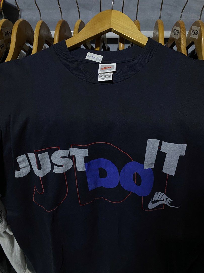 Vintage Nike Just Do It T-Shirt (Category: Tshirts & Polo Shirts ) located in Santa Ana. Submitted by tunes_vtg (Listing ID 1461035568, Image 2). Description: - Vintage Nike Single stitch - Features iconic 'Just Do It' graphic in grey and blue - Made in USA - Size M - Great for casual wear or workouts - Shows some signs of wear, but plenty of life left - A must-have for Nike fans - Excellent condition - No issues - Size M fit to L - Dimes:L29xW21