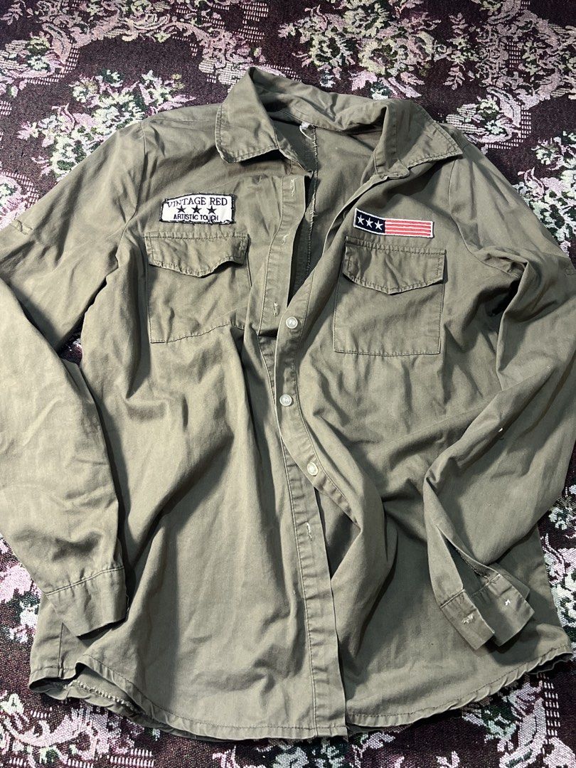 Vintage Red Artistic Touch Patch Work Shirt (Category: Tshirts & Polo Shirts ) located in Manila. Submitted by sennisen (Listing ID 1461094620, Image 2). Description: - Olive green long-sleeved shirt - Button-up front - Two chest pockets with button closures - 'Vintage Red Artistic Touch' patch on left chest - American flag patch (3 stars) on right chest - Ideal for a casual, retro aesthetic.