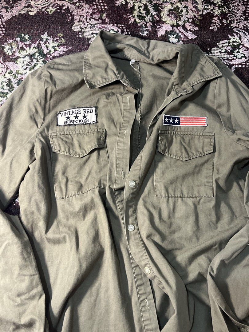 Vintage Red Artistic Touch Patch Work Shirt (Category: Tshirts & Polo Shirts ) located in Manila. Submitted by sennisen (Listing ID 1461094620, Image 1). Description: - Olive green long-sleeved shirt - Button-up front - Two chest pockets with button closures - 'Vintage Red Artistic Touch' patch on left chest - American flag patch (3 stars) on right chest - Ideal for a casual, retro aesthetic.