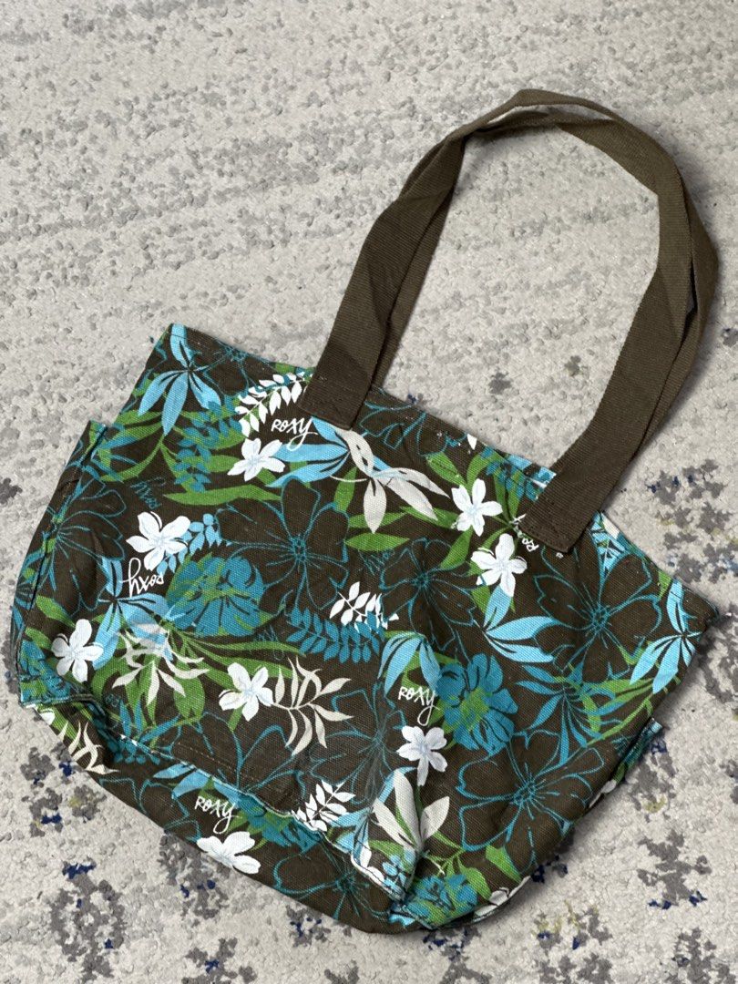 Vintage Roxy Canvas Floral Tote Bag (Category: Tote Bags) located in Daet. Submitted by thrifthings2018 (Listing ID 1461011028, Image 3). Description: - Cute vintage-style Roxy tote bag - Brown canvas with colorful floral print - Brown straps - Roomy interior and exterior pockets - Great for everyday use or beach trips - Made of 100% cotton.