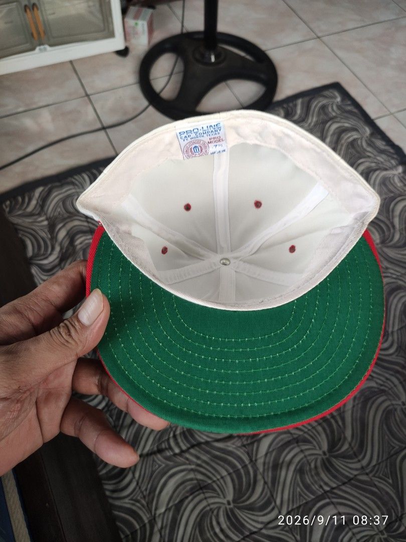Vintage UNLV Rebels Snapback Cap Red White Green (Category: Caps & Hats) located in Las Pinas. Submitted by vtg_sakalam2021 (Listing ID 1460956000, Image 3). Description: - Classic UNLV Rebels snapback hat - White front with bold red lettering - Red brim with a cool green underbrim - Features a unique embroidered cartoon character on the side - Perfect for any UNLV fan! - fitted hat 7 1/2.
