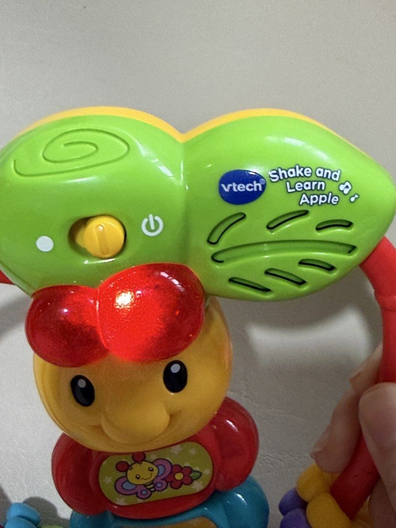 VTech Shake and Learn Apple musical baby rattle (Category: Infant Playtime) located in Angeles City. Submitted by holyfabclothing (Listing ID 1460938838, Image 2). Description: VTech Shake and Learn Apple musical baby rattle Key Features Early Learning: Introduces basic letters and numbers through sound.Interactive Play: Plays fun melodies, sound effects, and phrases when shaken or when buttons are pressed.Motor Skills: Designed with sliding piec