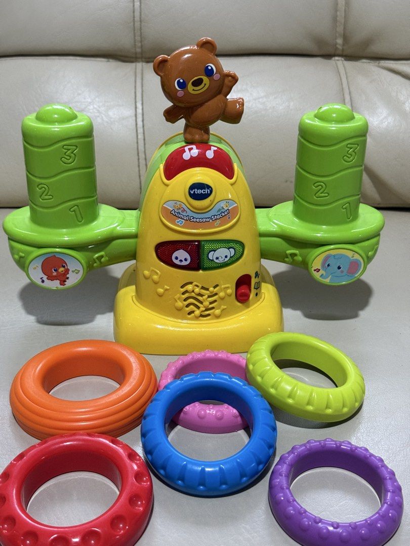 Educational toy VTech Stack & Balance Teeter Totter (the Animal Seesaw Stacker) (Category: Infant Playtime) located in Angeles City. Submitted by holyfabclothing (Listing ID 1460938742, Image 1). Description: Name: VTech Stack & Balance Teeter Totter (also known as the Animal Seesaw Stacker) Target Age: 12 to 36 months Features: Built-in balance sensor that detects if the rings are even, flashing light-up buttons, and interactive audio responses 
