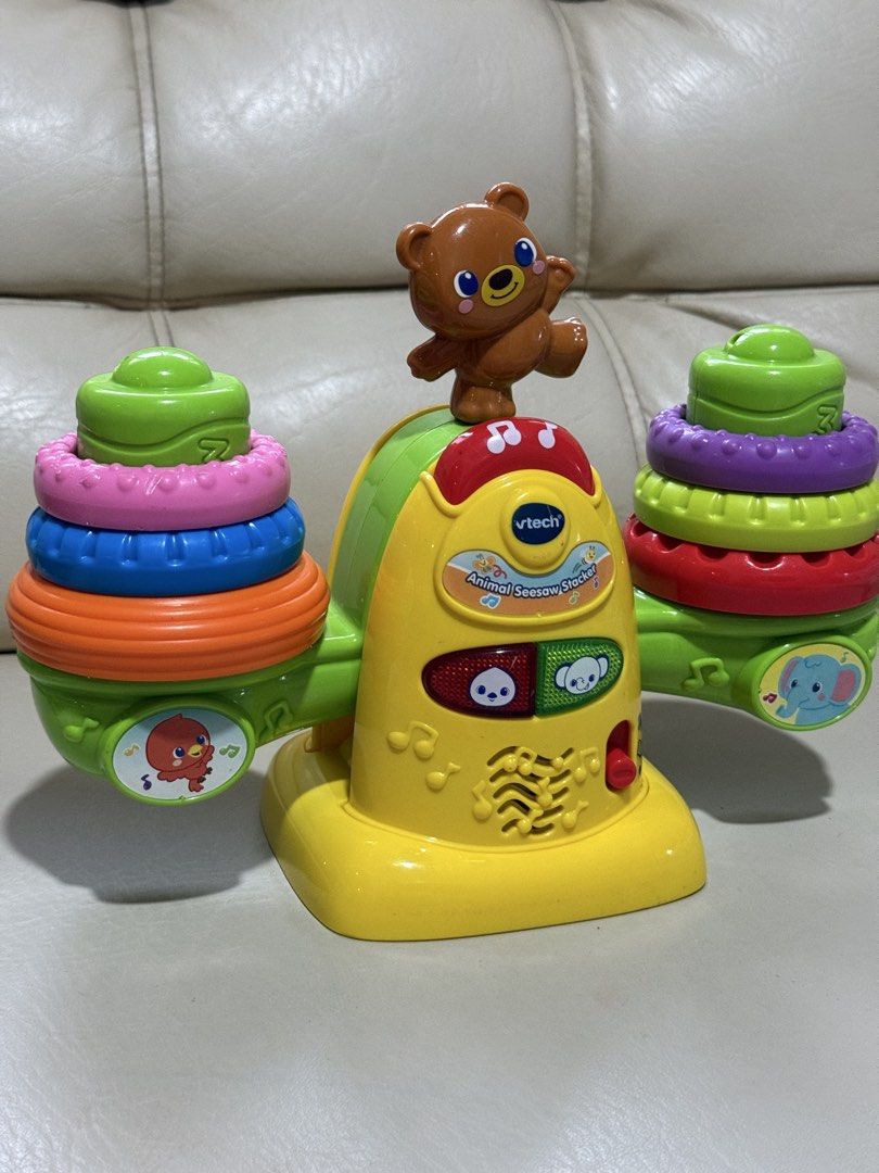 Educational toy VTech Stack & Balance Teeter Totter (the Animal Seesaw Stacker) (Category: Infant Playtime) located in Angeles City. Submitted by holyfabclothing (Listing ID 1460938742, Image 2). Description: Name: VTech Stack & Balance Teeter Totter (also known as the Animal Seesaw Stacker) Target Age: 12 to 36 months Features: Built-in balance sensor that detects if the rings are even, flashing light-up buttons, and interactive audio responses 