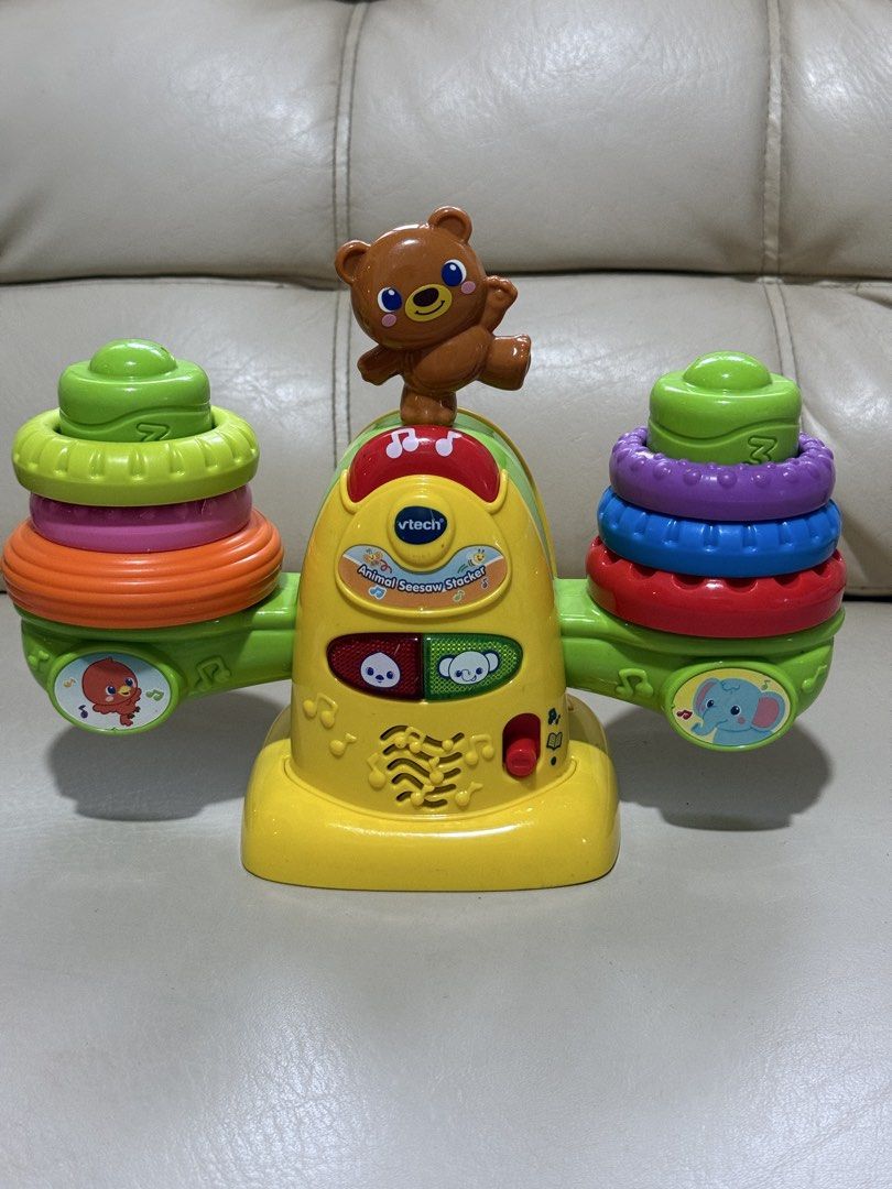 Educational toy VTech Stack & Balance Teeter Totter (the Animal Seesaw Stacker) (Category: Infant Playtime) located in Angeles City. Submitted by holyfabclothing (Listing ID 1460938742, Image 3). Description: Name: VTech Stack & Balance Teeter Totter (also known as the Animal Seesaw Stacker) Target Age: 12 to 36 months Features: Built-in balance sensor that detects if the rings are even, flashing light-up buttons, and interactive audio responses 